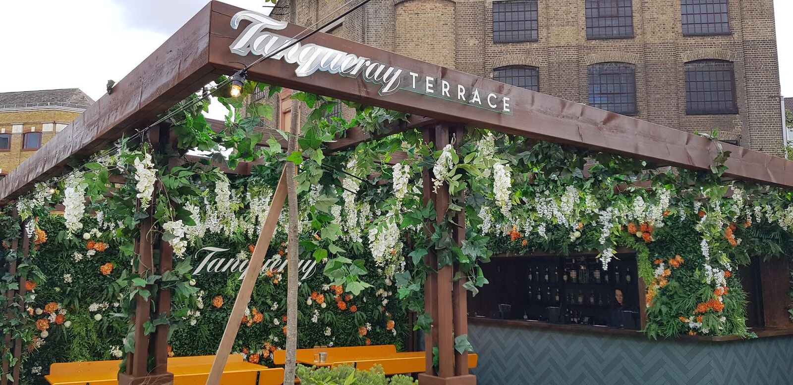 Terrace bar with floral wall