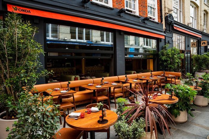 Fonda exterior with custom tables and terrace