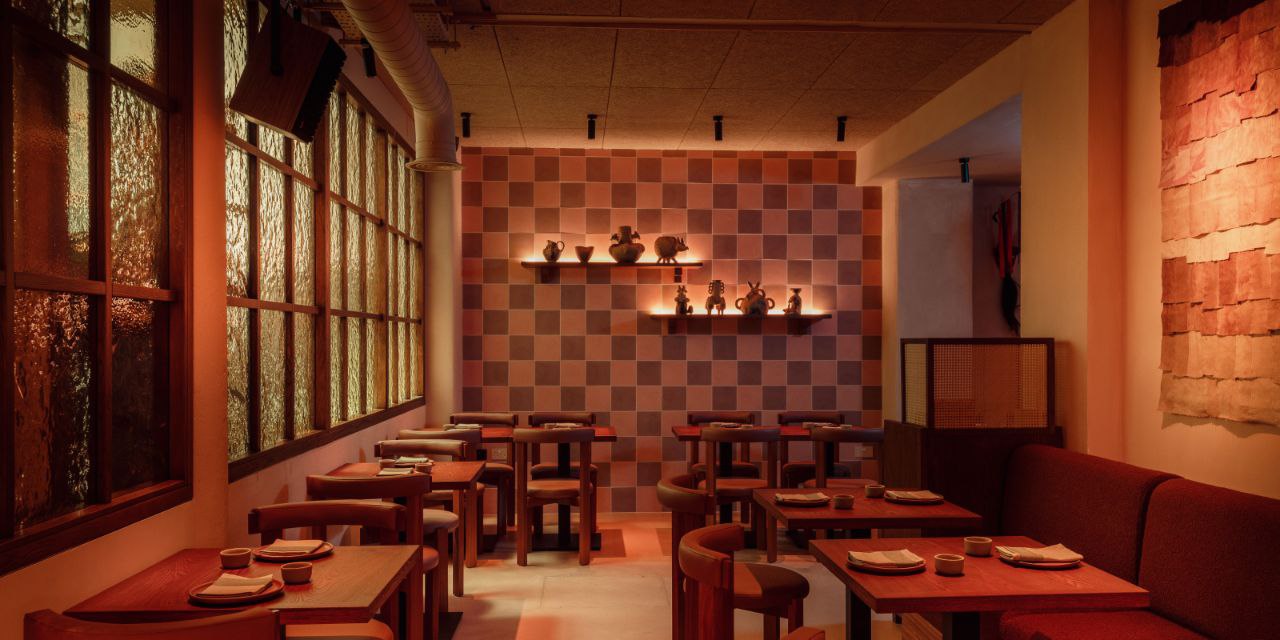 Fonda interior with checkerboard tiles and custom furniture