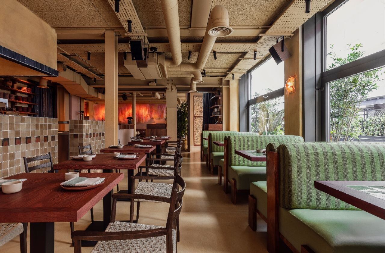 Fonda main dining room with custom tables and banquettes